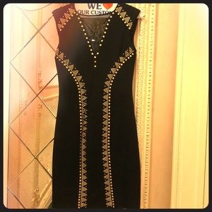 Black with gold studded dress.